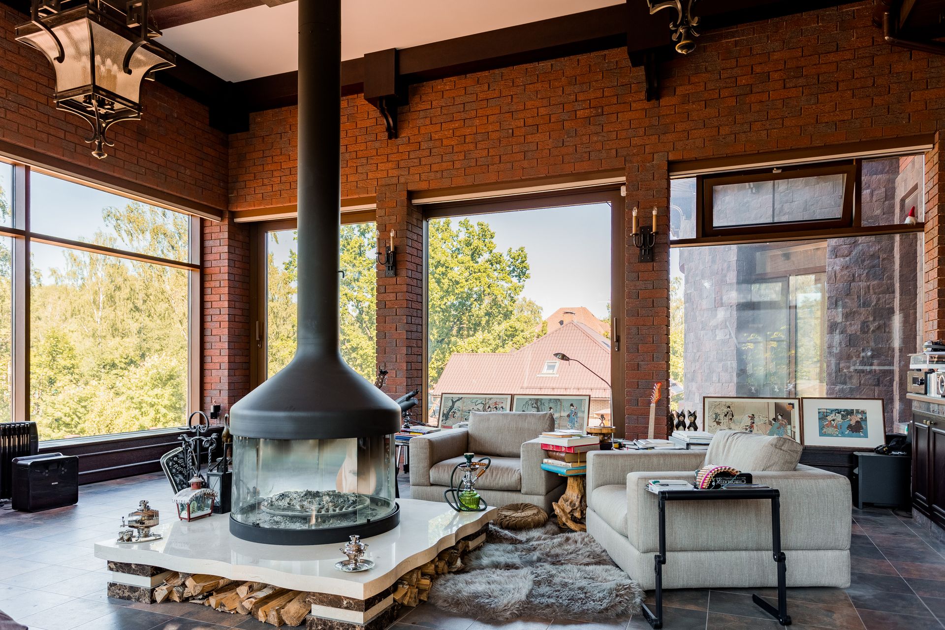 Bright living room with a modern fireplace and armchairs