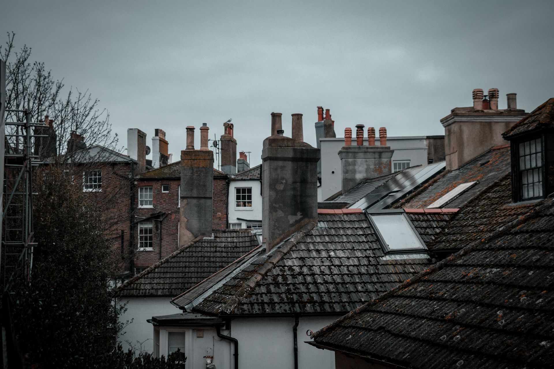 Houses with brick chimneys on their rooftops
